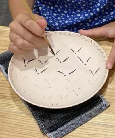 Plate being painted