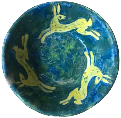 Yellow rabbits, blue background, painted plate